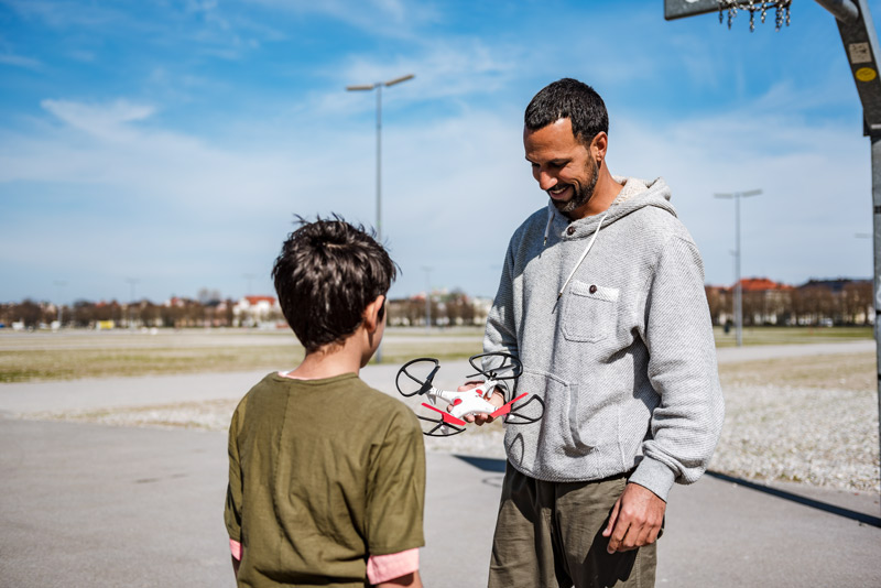Drones for kids: A father giving his son a drone as a present
